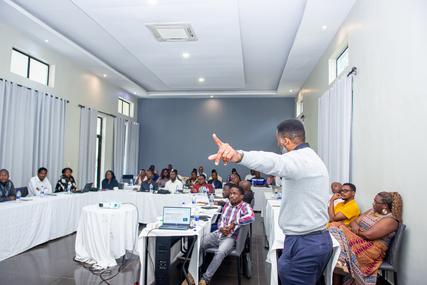 Photo: Dr. Amos Msekandiana leading the class